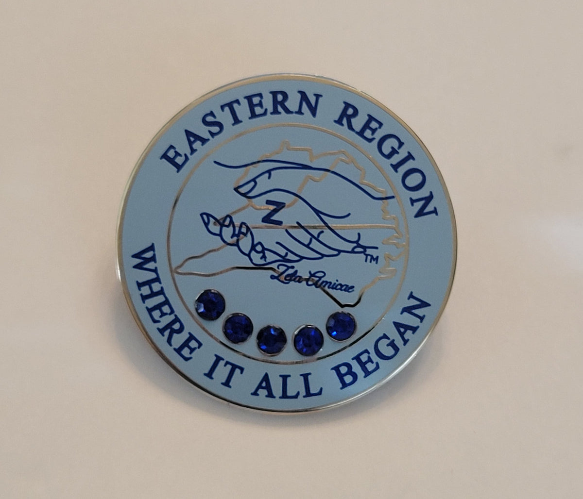 Easter Region Where it all began Amicae lapel pin