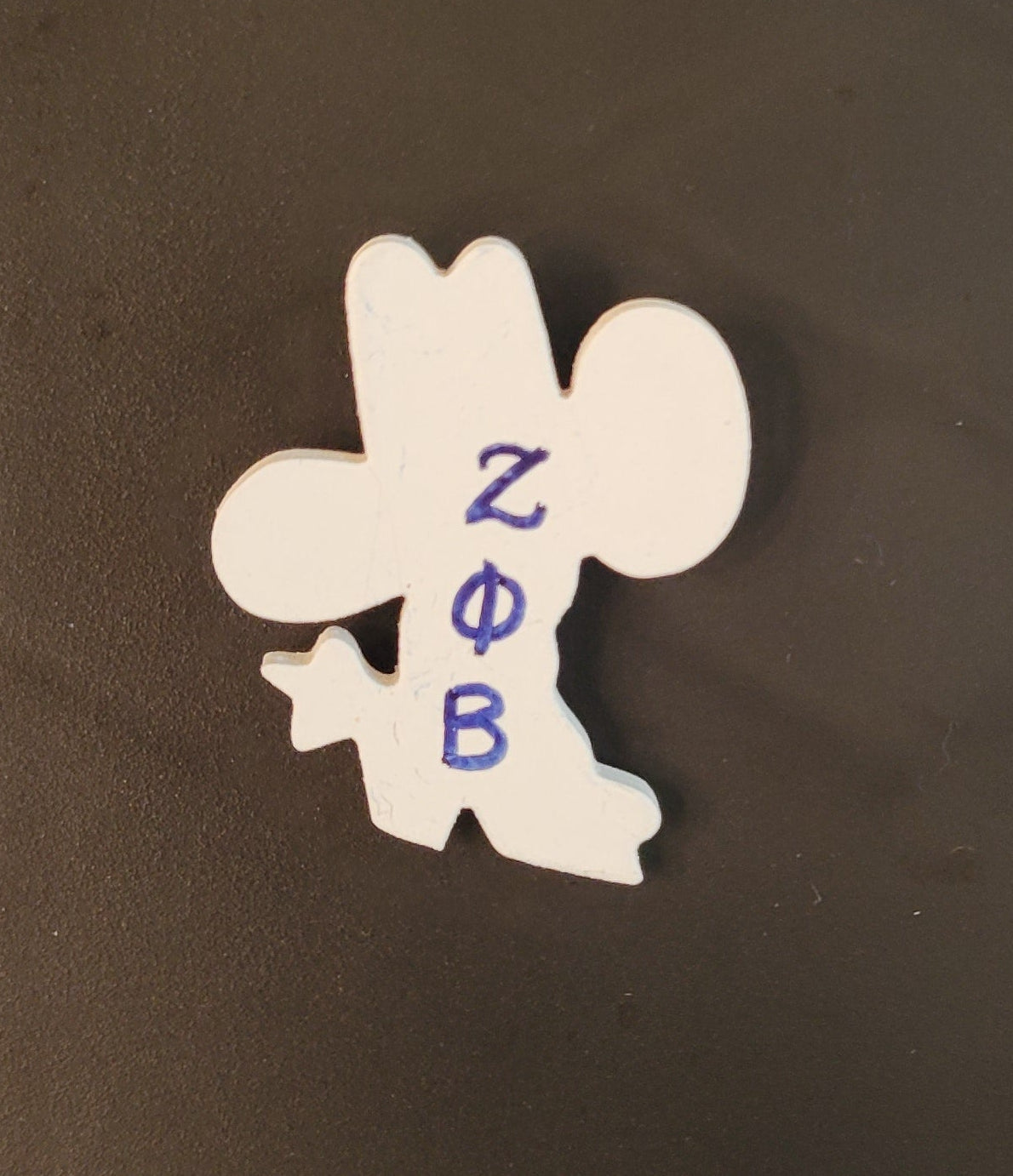 Zeta boots and hat lapel pin