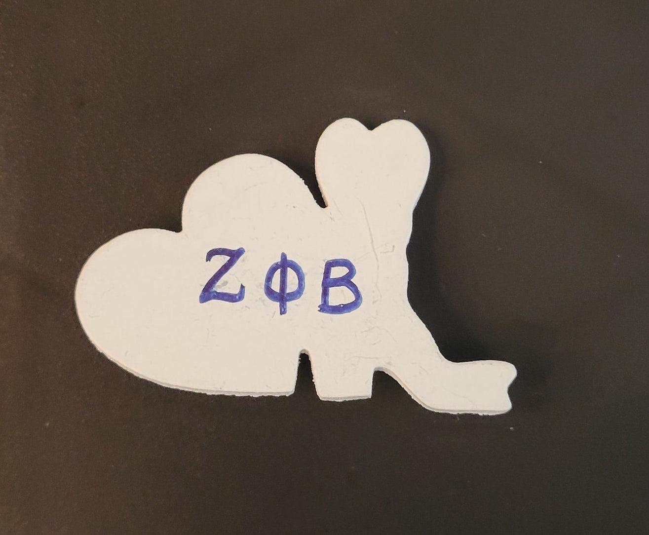 Zeta boots and heart lapel pin